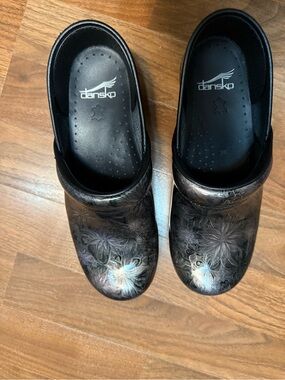 Dansko Black Floral Leather Clogs